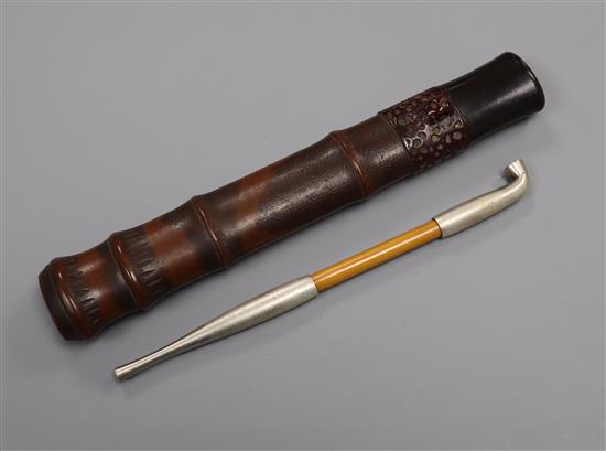 A Japanese lacquer tobacco pipe, cased length 22cm